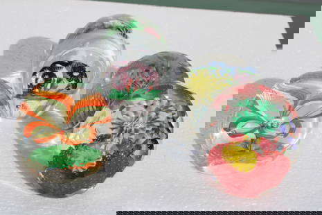 Four Italian Murano Flower Glass Paperweights, Fratelli Toso: Four Italian Murano flower glass paperweights. One of the paperweights has a label stating Made In Italy Fratelli Toso Vetreria Murano.They range from 3" - 4" high and 3" - 3.5" diameter.
