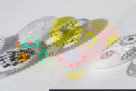 Four Italian Murano Glass Paperweights: Four Italian Murano glass paperweights. They range from 1.75" - 2.25" high and 2" - 2.5" diameter. One paperweight has some etching which we cannot decipher.