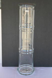 Blenko Bamboo Clear Vessel with Label.: Blenko hand blown bamboo clear vessel with label. Vase measures 25" high and 6"diameter. Manufactured by Blenko, USA. Blenko Glass Company is an art glass company that began producing in 1922 under th