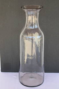 Blenko Clear Vessel: Blenko hand blown clear vessel. Vessel measures 22.5" high, 5.75" diameter on top and 8" bottom. Manufactured by Blenko, USA. Blenko Glass Company is an art glass company that began producing in 1922