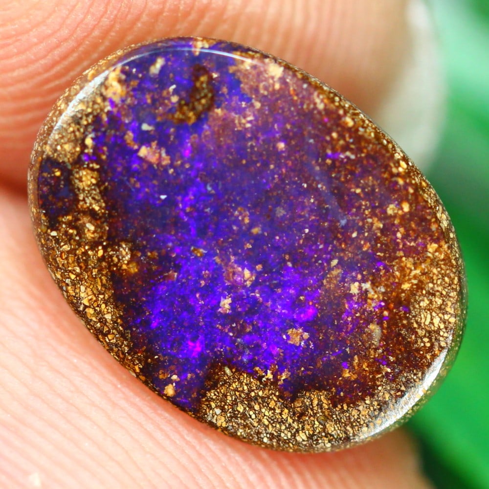 3.85 Carat Winton Boulder Opal - A Rare Treasure: This auction lot of 3.85 carat boulder opal from Winton, measuring 12.8x9.5x3.6mm, exemplifies the extraordinary beauty and craftsmanship of Australian opals. The boulder opal's unique interplay of co