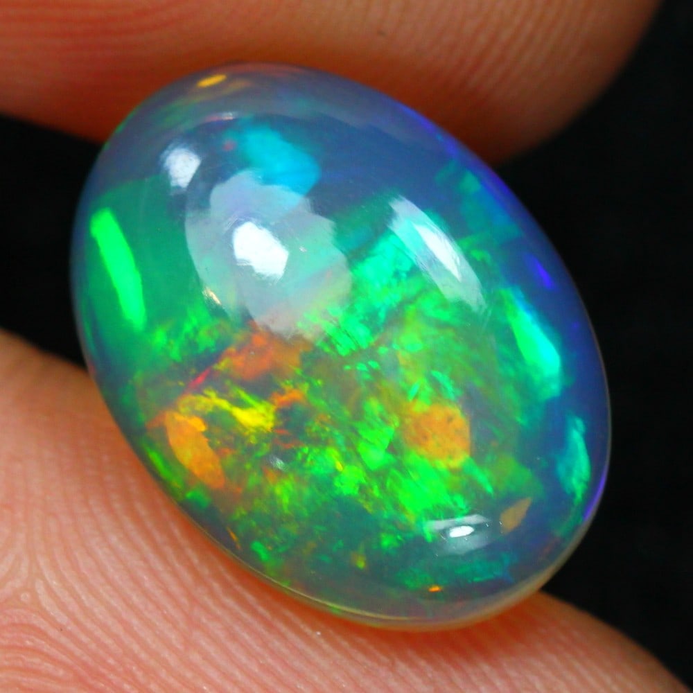 4.38carat Natural Ethiopian Welo Opal Loose Gemstone: Showcasing an Ethiopian Welo Opal loose gemstone, weighing approximately 4.38 carat, measuring 15.5x11.5x5.2mm, this exquisite gem exemplifies the delicate craftsmanship and vibrant play-of-color char