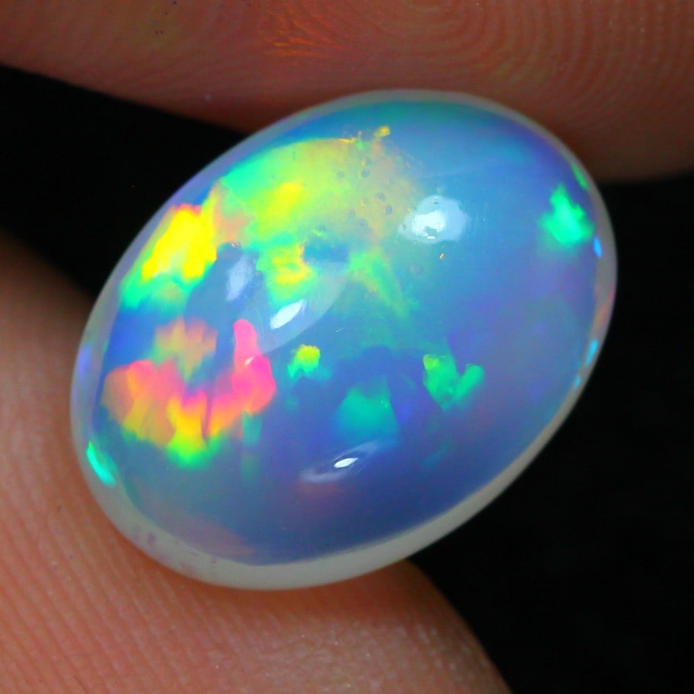 5.39 carat Natural Ethiopian Welo Opal Loose Gemstone: Showcasing Ethiopian Welo Opal loose gemstone, weight approximately 5.39 carat, measuring 14.1x10.9x6.5mm, exemplifies the mesmerizing play-of-color and exquisite craftsmanship. Ethiopian Welo Opals a