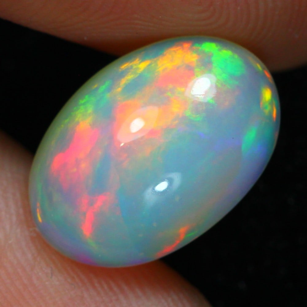 4.28 carat Natural Ethiopian Welo Opal Loose Gemstone: Showcasing Ethiopian Welo Opal loose gemstone, weight approximately 4.28 carat, measuring 15.1x10.4x5.8mm, exemplifies the mesmerizing play-of-color and exceptional translucence characteristic of Welo
