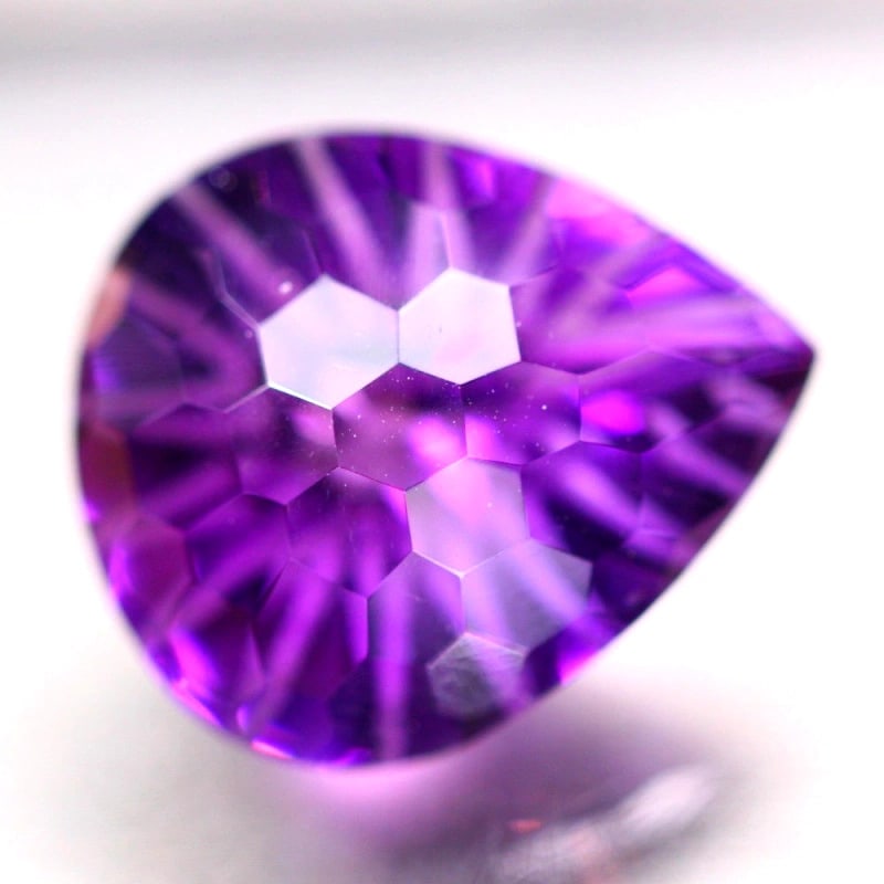 Exquisite 12.65 Carat Uruguayan Amethyst – Perfect for Fine Jewelry: Auction lot of 12.65 carat Uruguayan Amethyst, measuring 17.6x14.8x10.6mm. Birthstone for February and is often used in rings, pendants, and earrings. It is traditionally gifted for the 6th wedding an