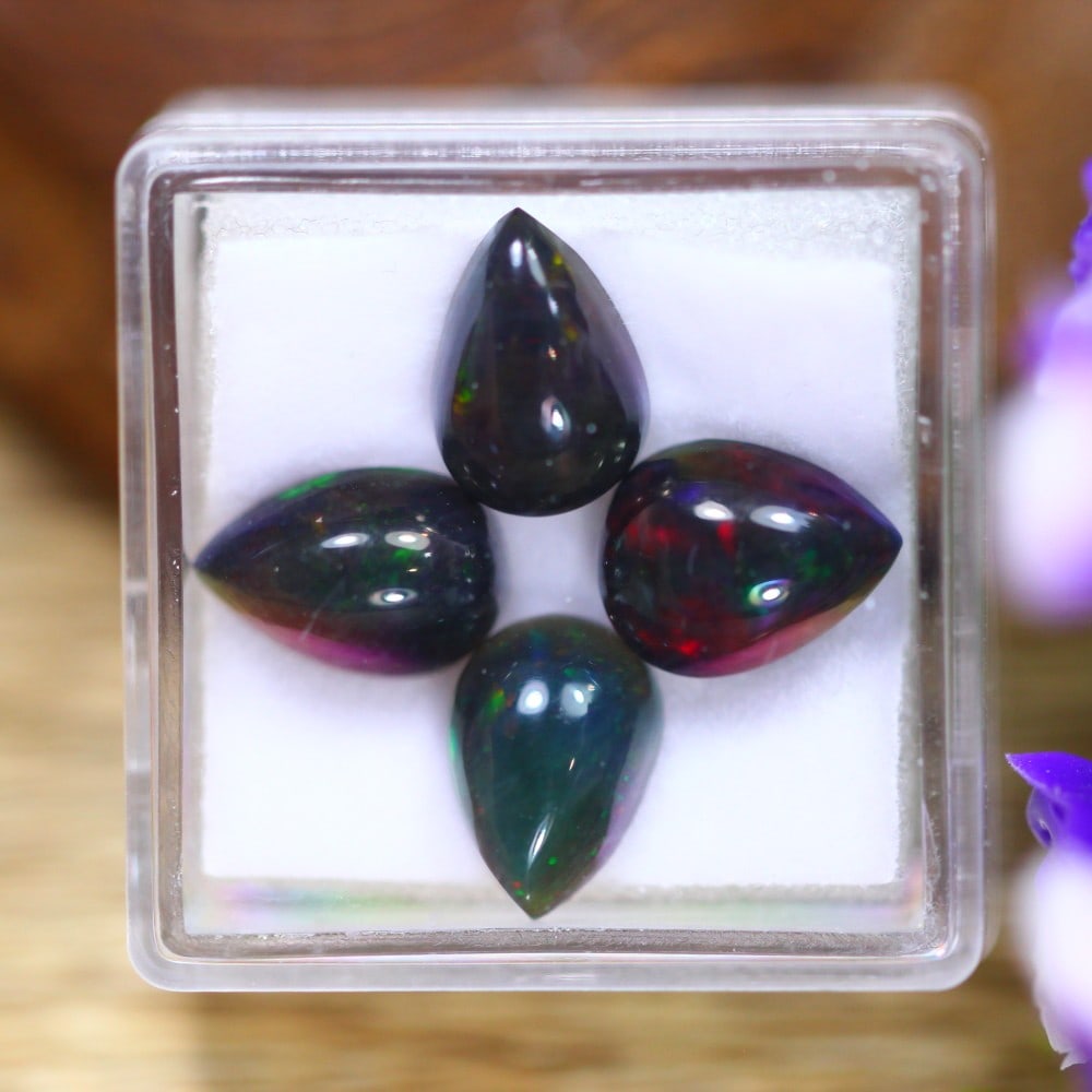 Exquisite 5.72 Carat Ethiopian Black Opal: Auction lot of 5.72 carat Ethiopian Black Opal, measuring 10.1x7.9x4.4mm. Birthstone for October and is often used in rings and pendants. It is traditionally gifted for the 14th wedding anniversary an