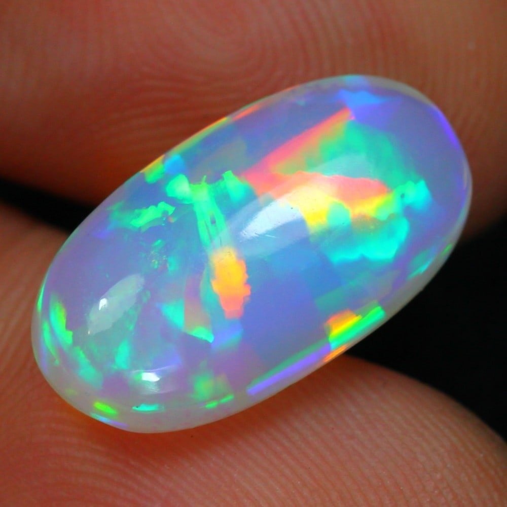 6.74carat Natural Ethiopian Welo Opal Loose Gemstone: Showcasing Ethiopian Welo Opal loose gemstone, weight approximately 6.74 carat, measuring 18.6x10.1x6.4 mm, exemplifies the masterful craftsmanship and vibrant, fiery play-of-color that Welo Opals are