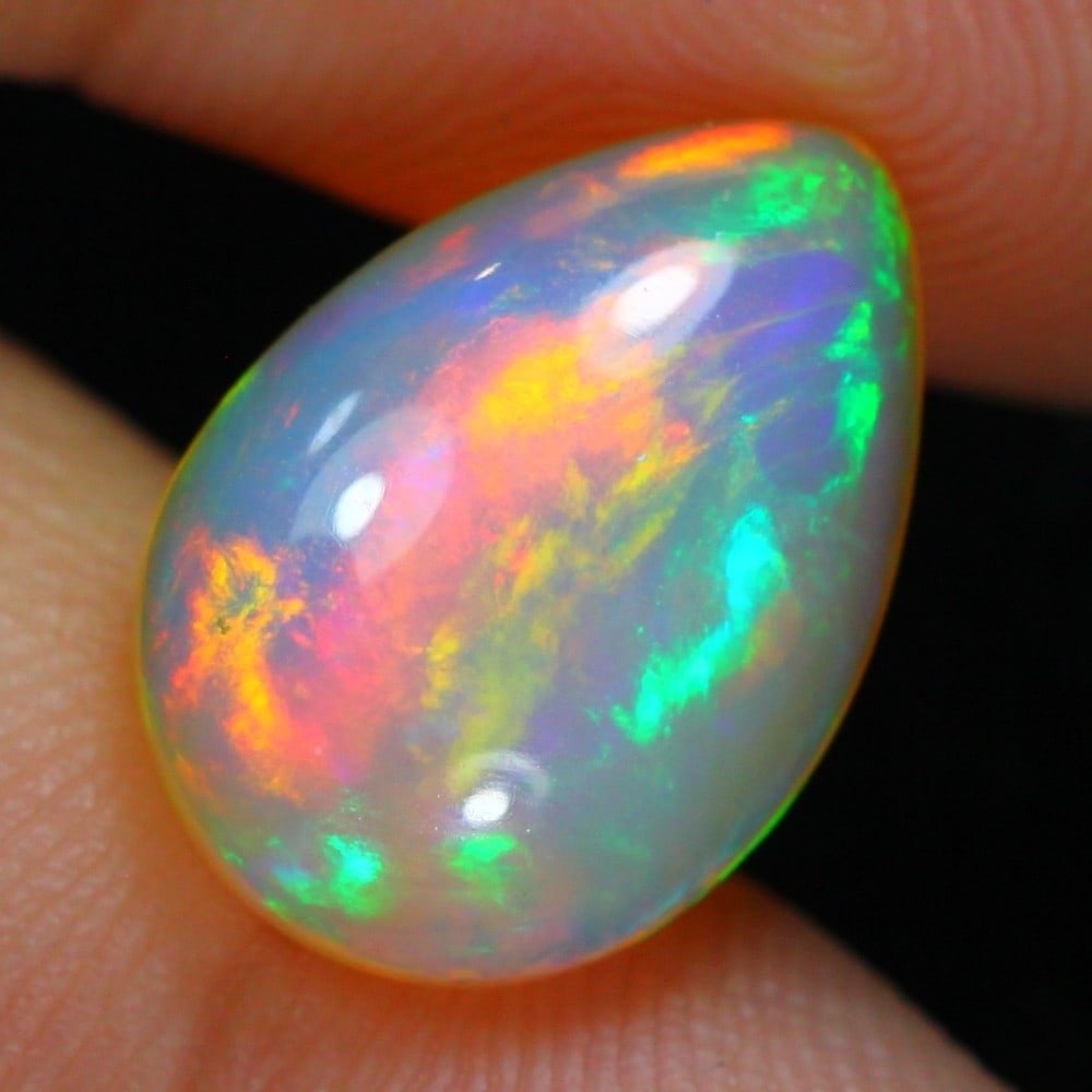 4.69carat Natural Ethiopian Welo Opal Loose Gemstone: Showcasing Ethiopian Welo Opal loose gemstone, weight approximately 4.69carat, measuring 14.7x10.3x5.7mm, exemplifies the vibrant beauty and exceptional craftsmanship of Ethiopian opals, known for the