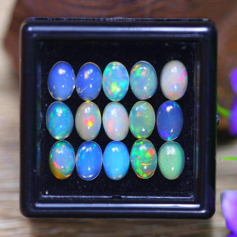 Ethiopian 4.99 Carat Welo Opal - Mesmerizing Fire and Brilliance: Auction lot of 4.99 carat Ethiopian Welo Opal, measuring 5.9x4.1x2.7mm. Birthstone for October and is often used in rings, pendants, and earrings. It is traditionally gifted for the 14th wedding anniv