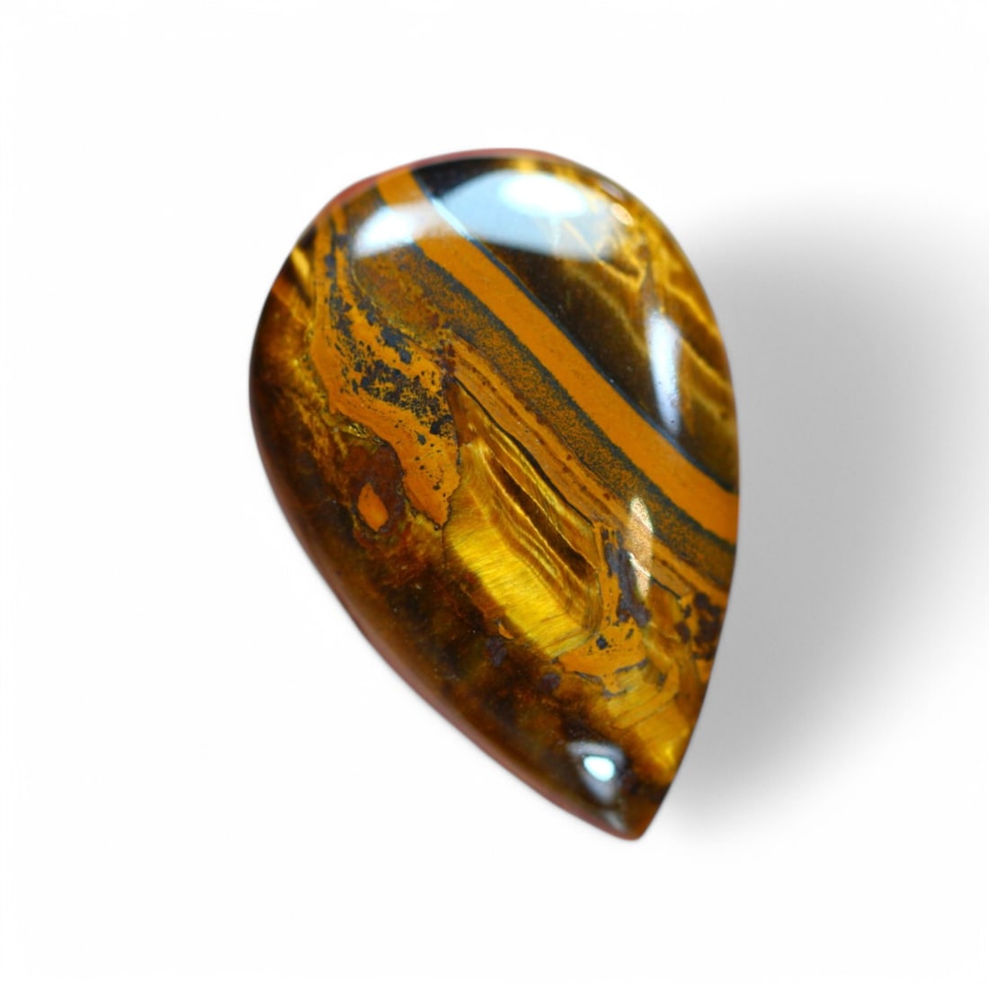 28.34 Carat Natural Golden Tiger Eye Cabochon: Auction lot of Africa Tiger Eye Gem Type: Natural Tiger Eye Carat Weight: 28.34Ct Dimension: 29.2 x 19.8 x 5.7 mm Origin: Africa Treatment: Unheated Type: Cabochon, Polished Birthstone for June and is
