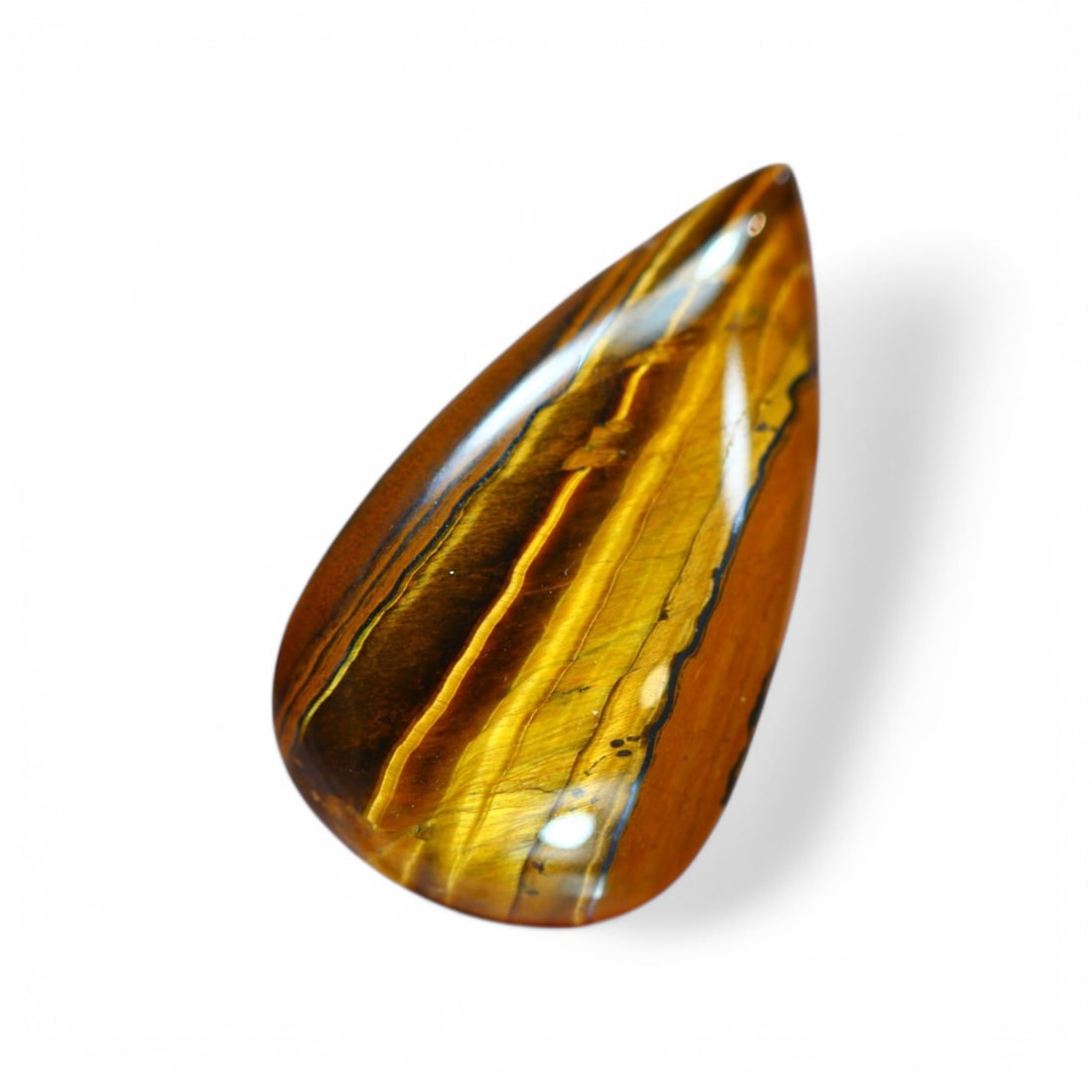 36.30 Carat Natural Golden Tiger Eye Cabochon: Auction lot of Africa Tiger Eye Gem Type: Natural Tiger Eye Carat Weight: 36.30Ct Dimension: 32.3 x 18.4 x 7.3 mm Origin: Africa Treatment: Unheated Type: Cabochon, Polished Birthstone for June and is