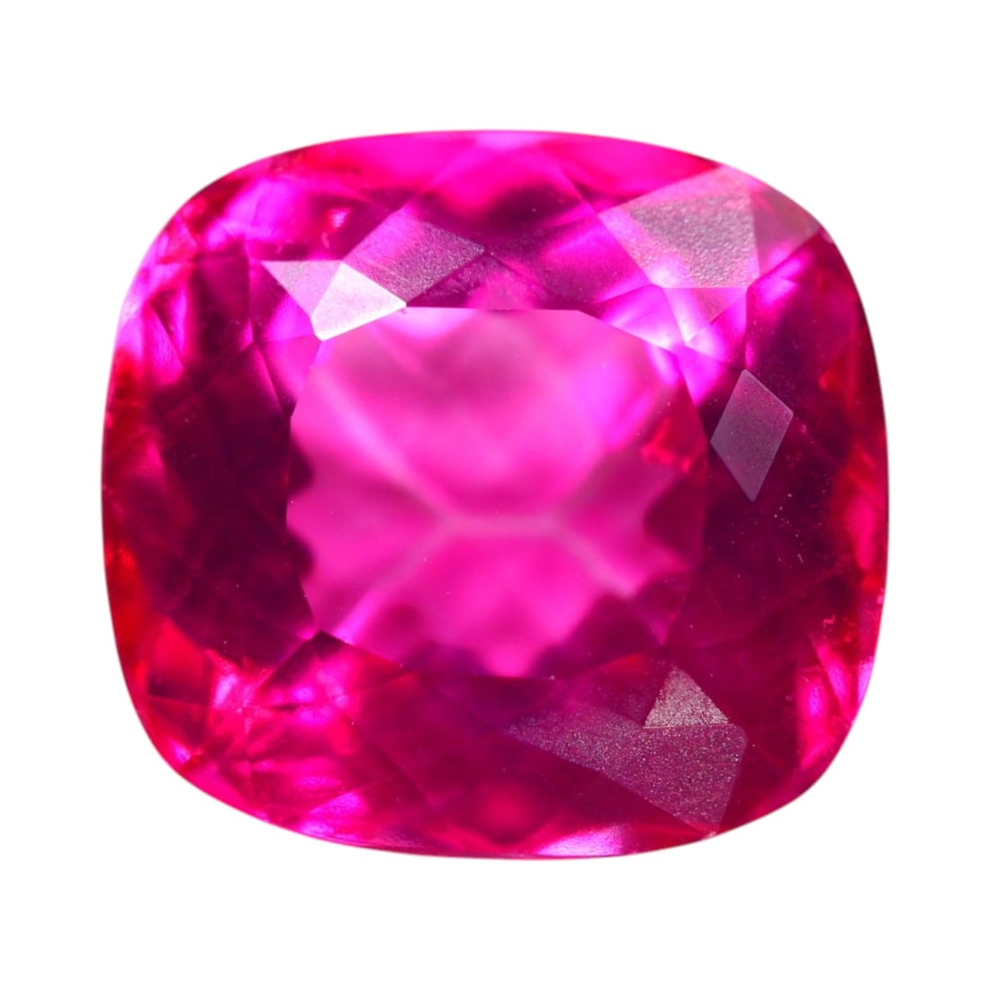 25.01 Carats Vivid Pink Topaz Cushion - Natural Brazilian Gem: This commanding cushion-cut pink topaz radiates with bold, saturated magenta tones, accentuated by a precise, brilliant cut that floods the stone with internal fire. The clarity is exceptional, with a