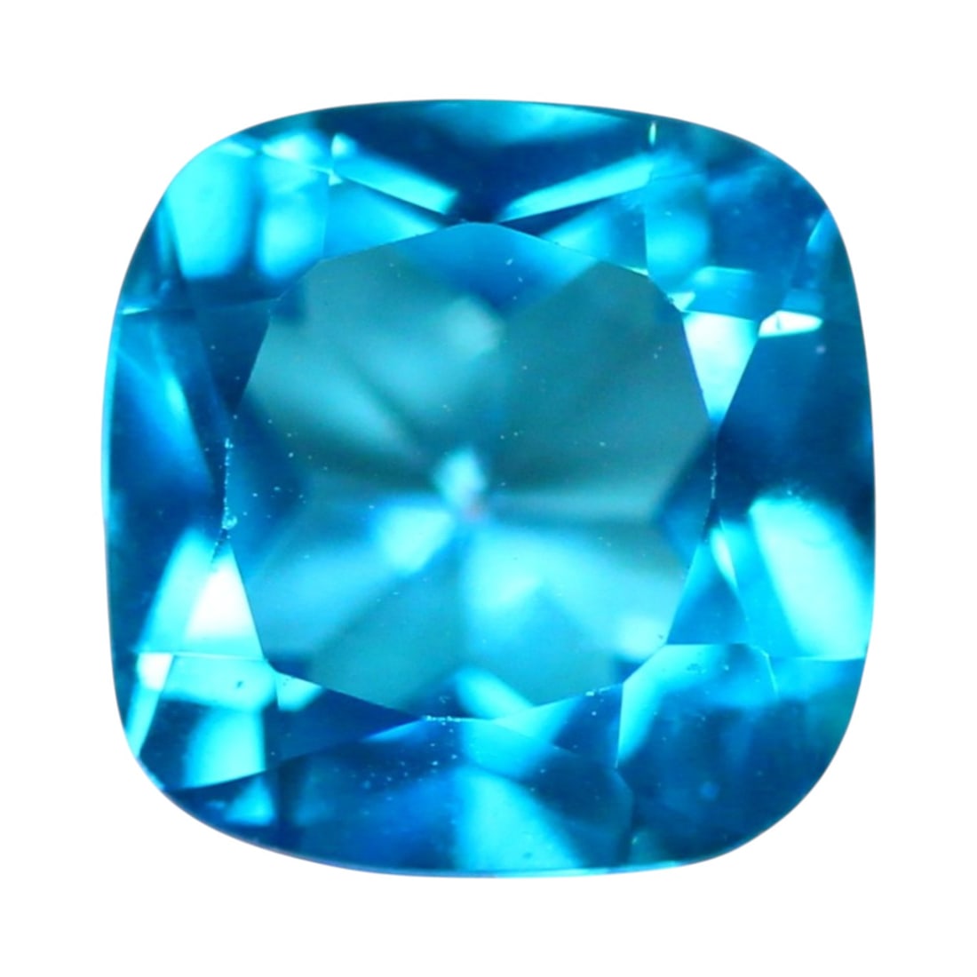 1.89 Carats Neon Blue Paraiba Color Topaz Cushion - Natural Brazilian Stone: This 1.89 carat cushion-cut topaz radiates with the signature neon blue associated with Paraiba-style stones, offering intense saturation in a refined, symmetrical shape. Measuring approximately 7 x 4