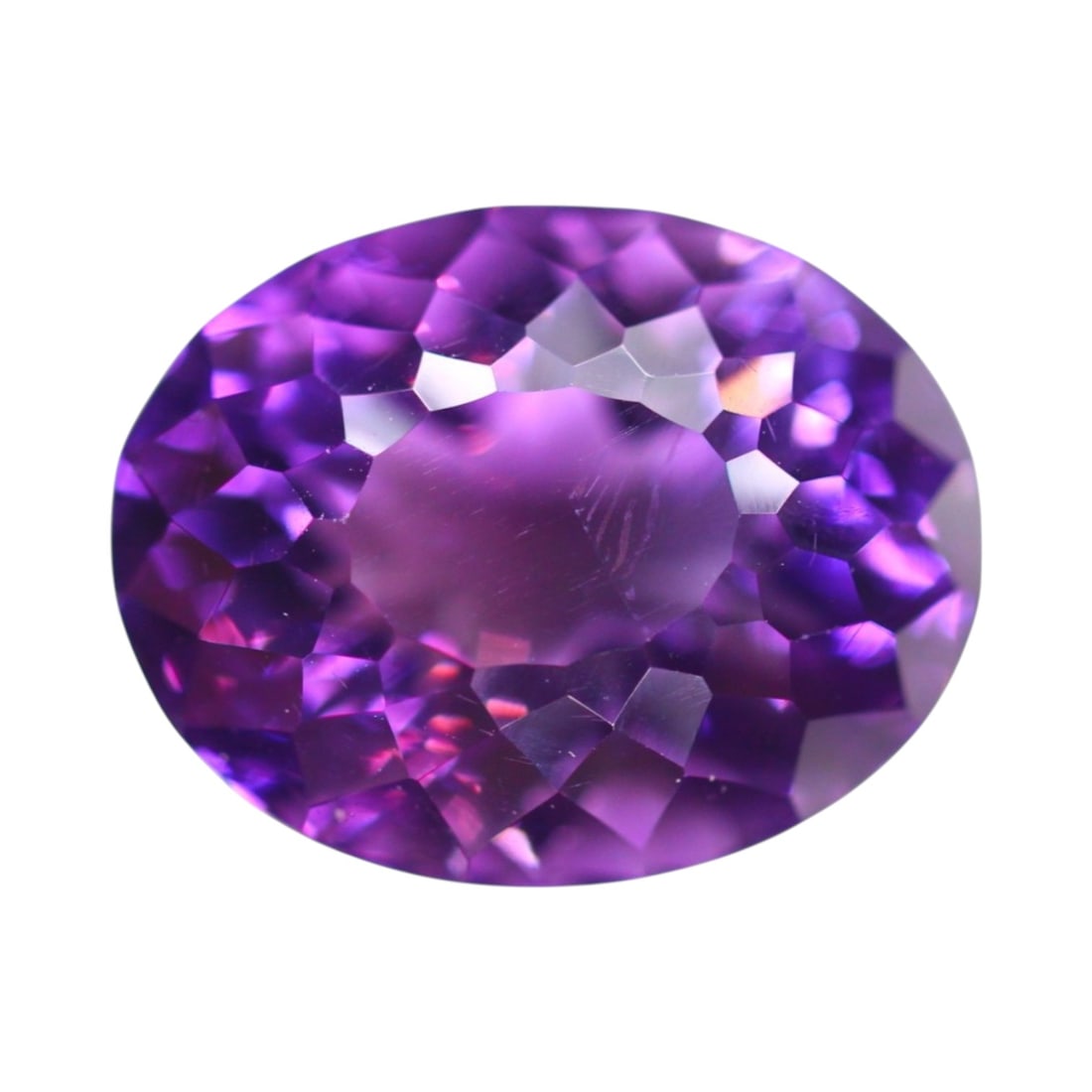 17.07 Carats Royal Violet Amethyst Oval - Natural Brazilian Gem: Glowing with bold saturation and regal allure, this 17.07-carat amethyst is cut in a richly faceted oval measuring approximately 17.5 x 13.9 x 12 mm. Its deep violet body is accented by flashes of fuc