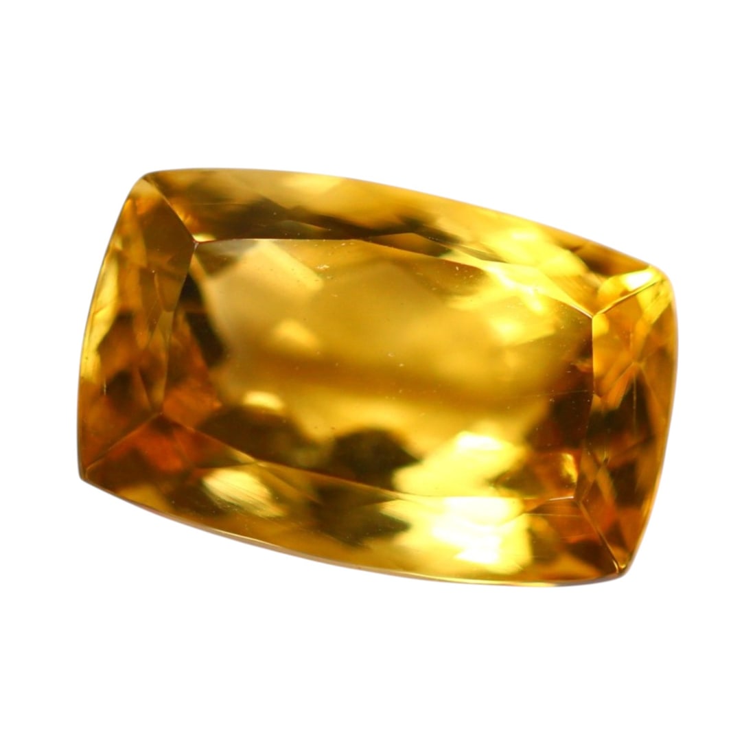 9.92 Carats Golden Yellow Citrine Octagon - Natural Loose Gemstone: This striking octagon-cut citrine gleams with golden brilliance, its elongated profile and crisp step-cut facets delivering a refined and architectural elegance. The warm yellow hue evokes sunlight fi