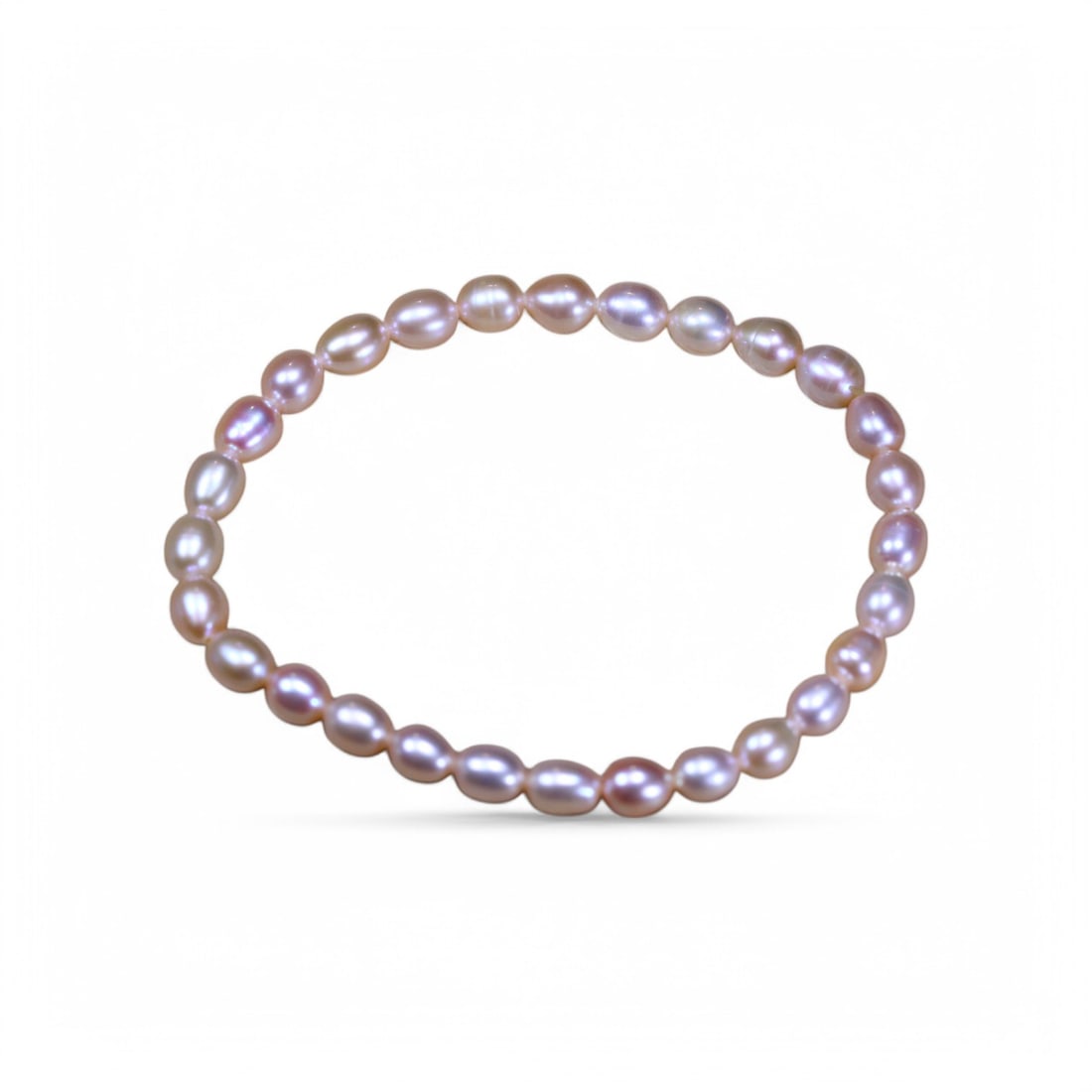40.51 Carats Lavender Pink Freshwater Pearl Bracelet - Natural Oval Beads: This bracelet features an elegant arrangement of lavender-pink freshwater pearls, each glimmering with a soft, metallic luster. The pastel tones blend rose, orchid, and silvery hues into a dreamy pale