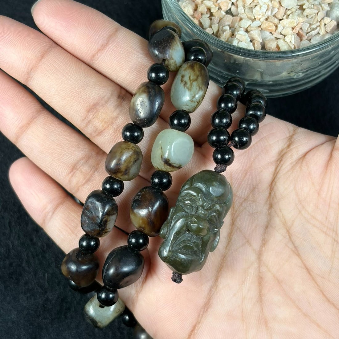 Natural Xinjiang Hetian Nephrite Black Skin Seed Pebble Necklace With Luohan Head Pendant, 25AT: This complete wearable jade necklace strand measures 69 cm in full length, crafted from genuine untreated Xinjiang Hetian nephrite river seed pebbles covered in rich natural black russet skin patina. 