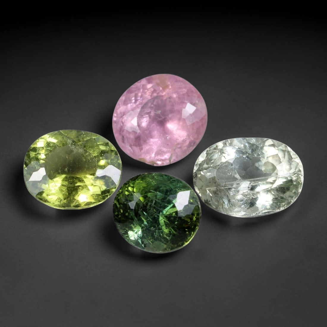 5.99 Carats Natural Multicolor Tourmaline - Faceted Gemstone, 38XB: Faceted tourmaline gemstone, crafted from natural tourmaline material. The stone exhibits a spectrum of vivid natural hues, including lime green, deep forest green, soft pink, and clear white, with na