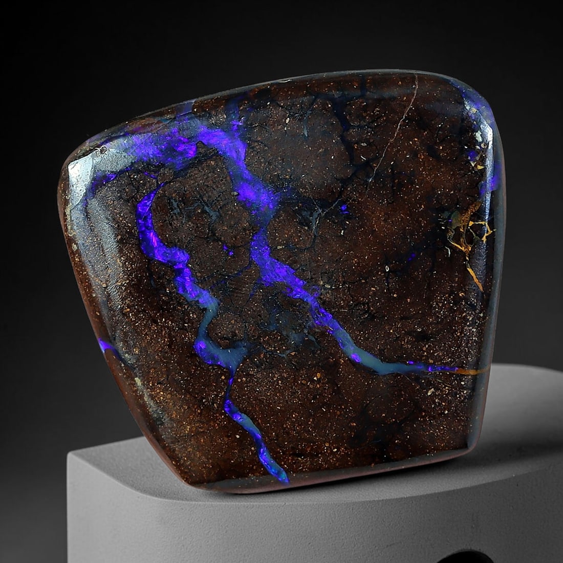 7.86ct Natural Australian Queensland Matrix Boulder Opal Freeform Cushion Cabochon, 70AV: Hand polished compact freeform cushion cabochon crafted from natural Queensland matrix boulder opal, featuring fine glitter-speckled deep chocolate ironstone matrix dominated by a sweeping branching l