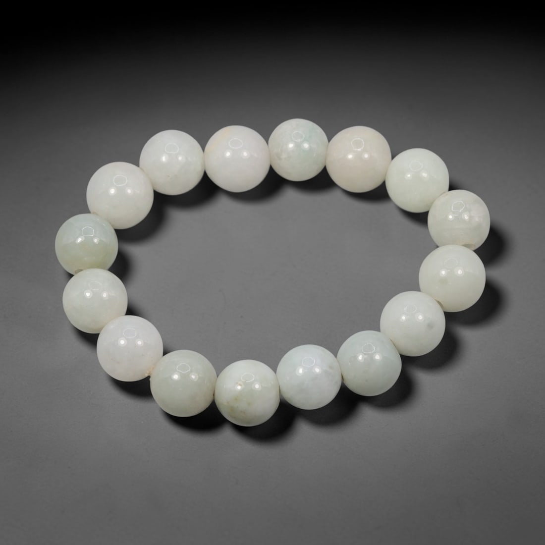 Natural Burmese Type A Jadeite Jade Round Bead Bracelet, 36ZK: I've got a real nice parcel here to show you, this strung bracelet crafted from genuine Burmese Type A jadeite beads, with an inner diameter of approximately 6 centimeters. These evenly sized, smoothl