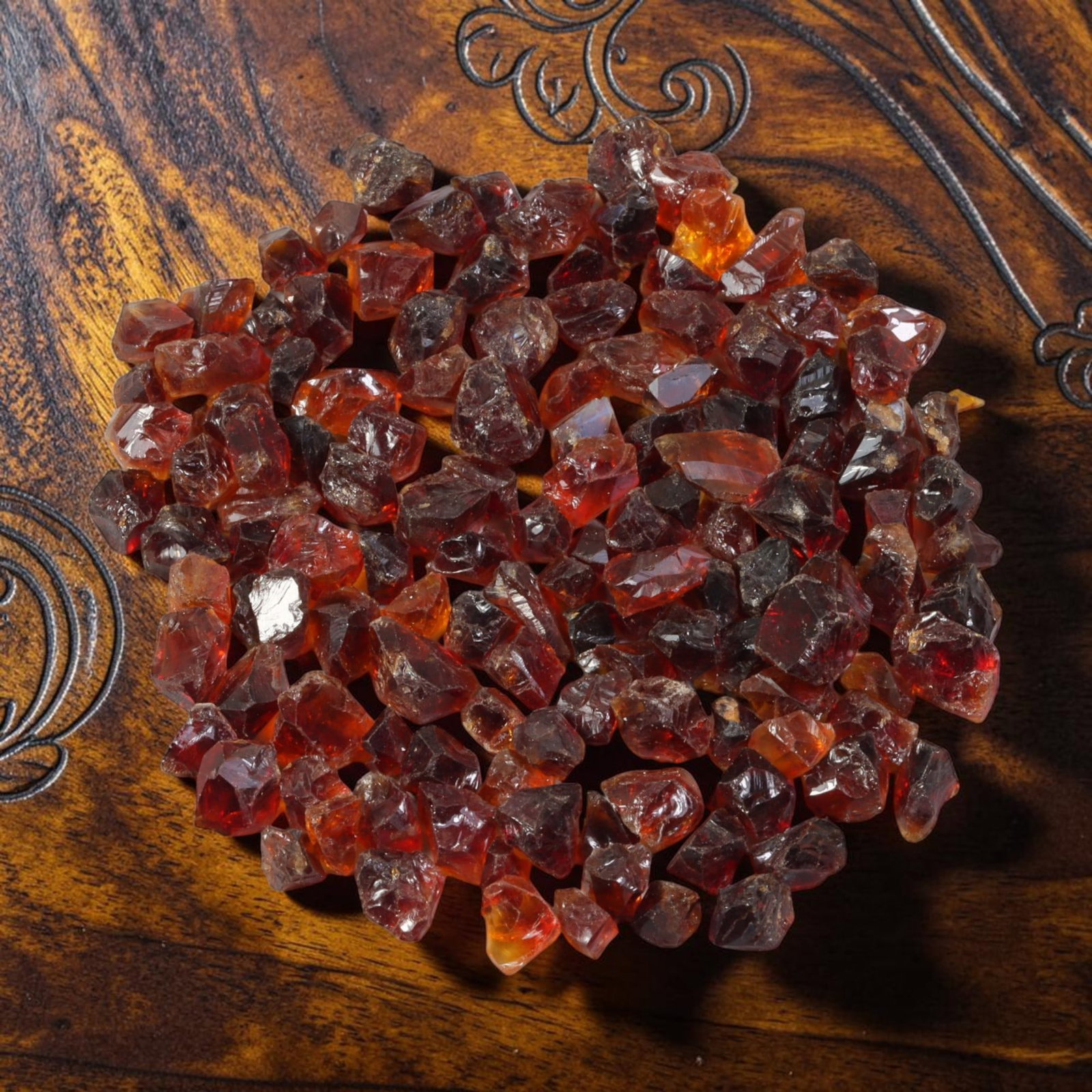 123.54 Carats Natural Garnet Rough Parcel, 99YH: This rich parcel of natural garnet rough displays deep saturated reddish-brown and fiery orange-red tones characteristic of almandine garnet, with natural translucent to semi-transparent crystalline s