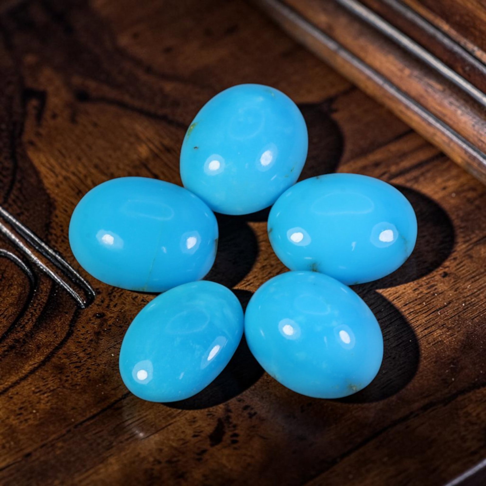 9.52 Carats Natural Arizona Sleeping Beauty Turquoise Oval Cabochon Parcel, 89WC: This parcel features polished oval cabochons of authentic Arizona Sleeping Beauty Turquoise, celebrated for its signature uniform vivid sky-blue color from this iconic mining locality. Each calibrated