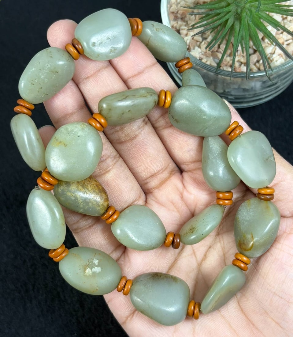 Lot of 2 Natural Celadon Hetian Nephrite Seed Jade Bracelets, 21AS: Set of 2 hand-strung bracelets made of genuine celadon Hetian nephrite river seed jade pebbles, with the largest natural tumbled jade beads measuring 2.2cm. Each organic irregular pebble retains natur