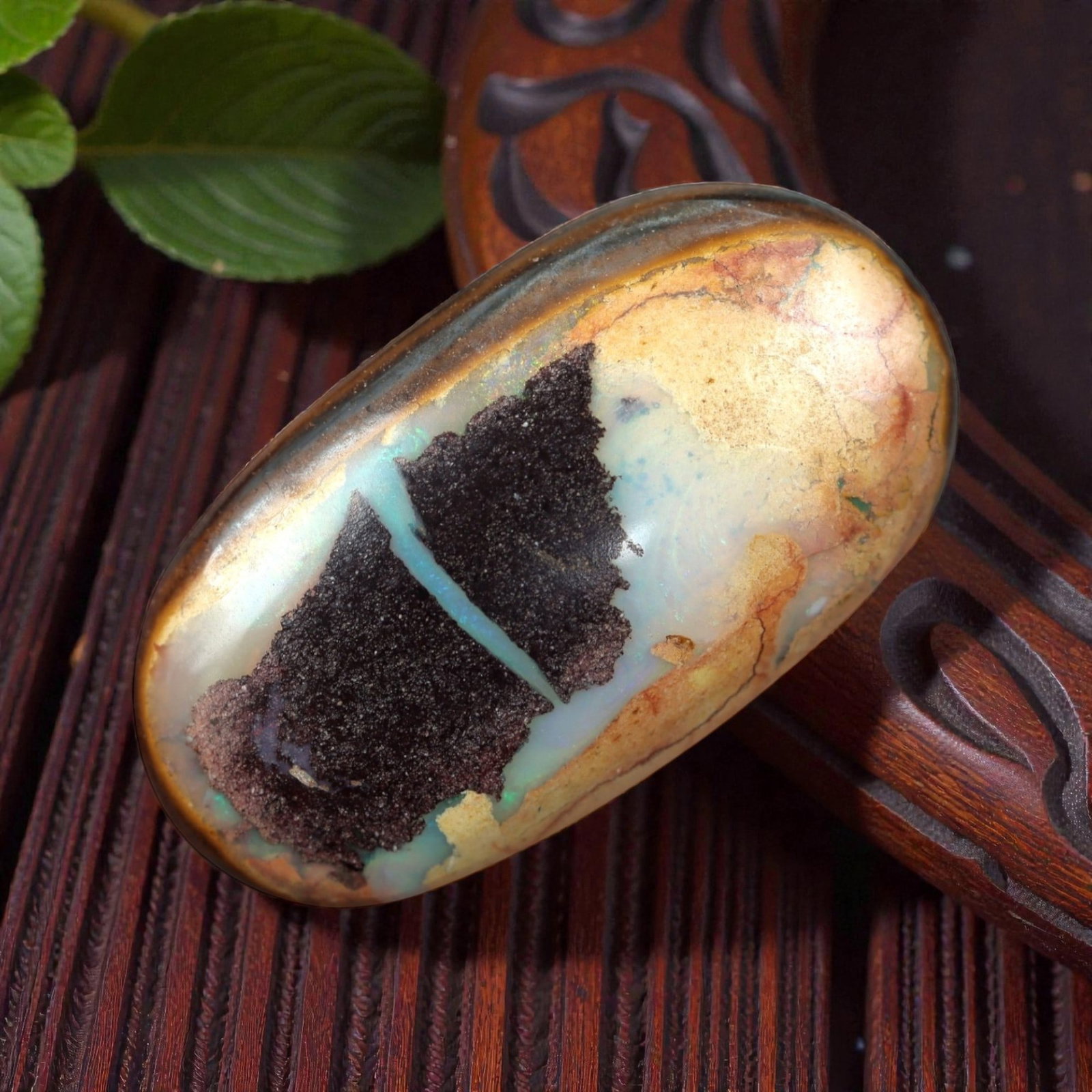 6.68 Carats Cream-Blue Boulder Opal with Dark Matrix - Natural Australian Stone, 36XM: This substantial boulder opal presents a striking visual narrative, with a creamy, pale base that transitions into soft, iridescent blue opal layers, all dramatically framed by a large, dark, textured