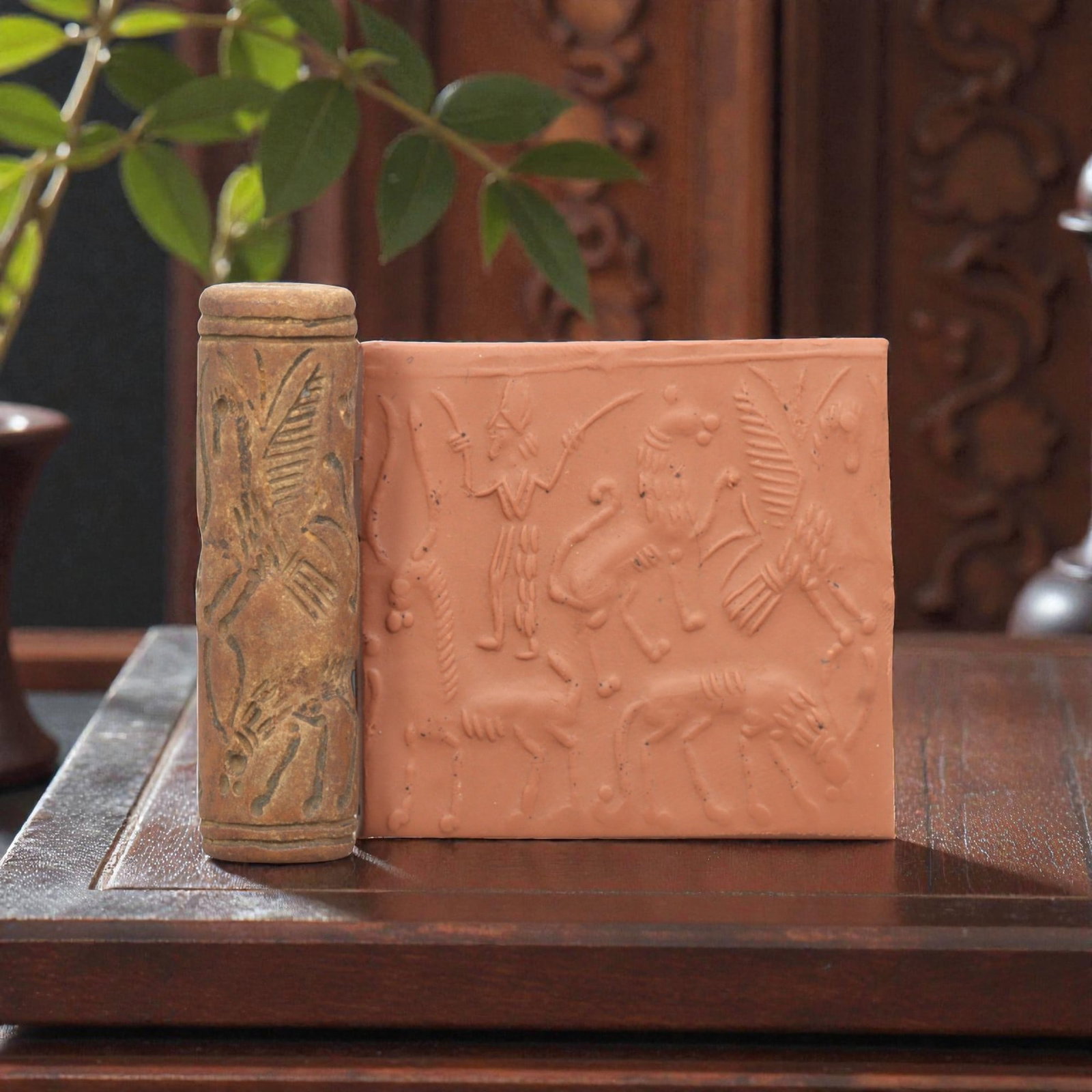 Ancient Steatite Cylinder Seal - Mesopotamian Mythological Combat Scene, 93ZR: Carved from dense steatite, this ancient Mesopotamian cylinder seal presents a detailed mythological combat scene in linear relief, featuring a human figure with weapons alongside winged and quadruped