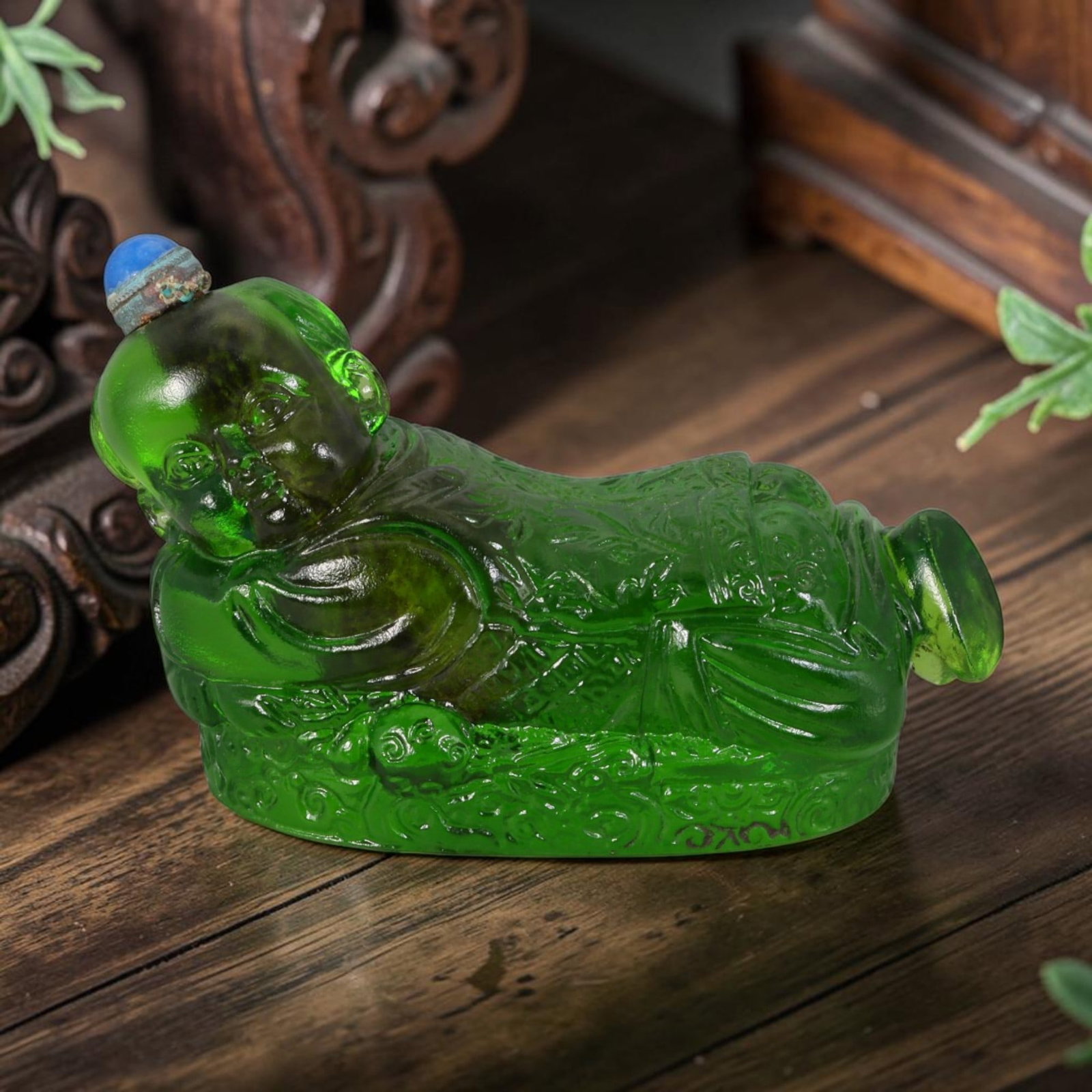 Vintage Chinese Liuli Glass Snuff Bottle - Reclining Lucky Child Embossed Green Vessel, 42AS: This uniquely sculpted anthropomorphic snuff bottle is handcrafted from glossy translucent emerald vintage Chinese liuli glass, shaped as a reclining traditional lucky child figure resting atop a rich