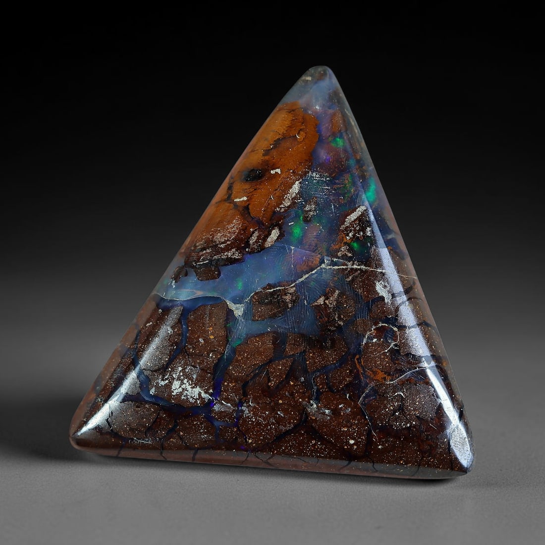 12.37ct Natural Australian Queensland Matrix Boulder Opal Triangular Cabochon, 24AV: Hand polished smooth symmetrical triangle cabochon of natural Queensland matrix boulder opal, featuring rich speckled brown ironstone matrix split between warm amber-brown opal bands at the apex and t