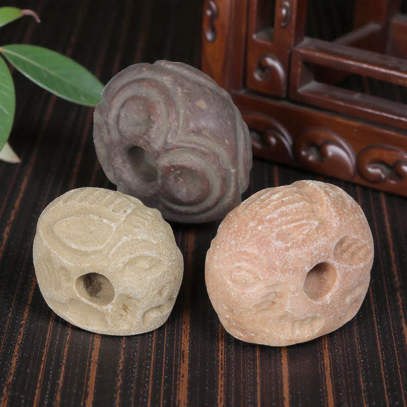 Lot of 3 Sasanian Stone Stamp Seals, Circa 3rd-7th Century CE, 2AG: Comprising three seals carved from stone, each of varying coloration including reddish-brown, light beige, and pinkish tones, all exhibiting natural surface wear and patina consistent with age. Each s