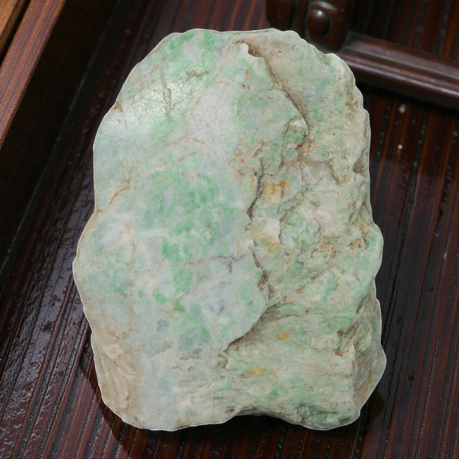 735ct Natural Burmese Moss in Snow Jadeite Rough - Light Green Patterned Stone, 65EA: This is a natural Type A Burmese jadeite rough stone, measuring 6.5x5cm and weighing 147g (735ct). It features the classic "Moss in Snow" pattern, with soft light green patches and streaks naturally s