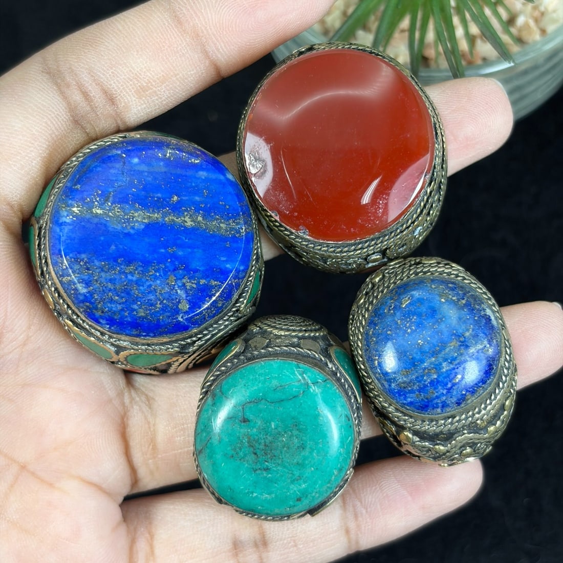 Vintage Central Asian Silvered Gilt Lapis Turquoise Carnelian Inlay Rings Lot, 96AS: This four-piece lot consists of untested silvered alloy wide domed rings crafted in classic Central Asian nomadic tribal style, constructed with intricate twisted wire filigree and brass gilt overlay 