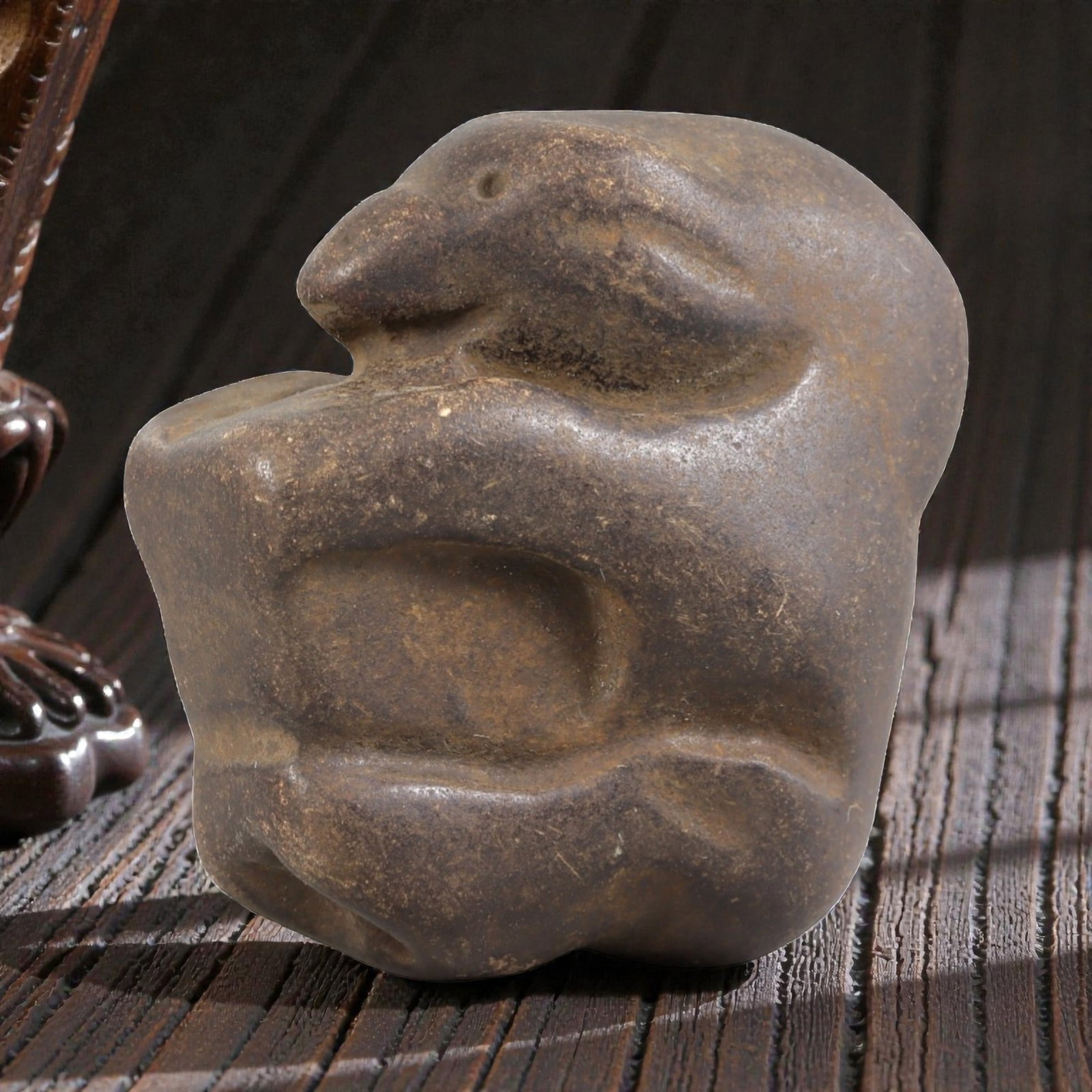 Ancient Stone Zoomorphic Effigy - Near Eastern Figurine, 5FY: Carved from a dense, smooth stone, this effigy depicts a stylized crouching animal-likely a rodent or small mammal-in a compact, rounded form. Relief details define the snout, circular eye socket, and