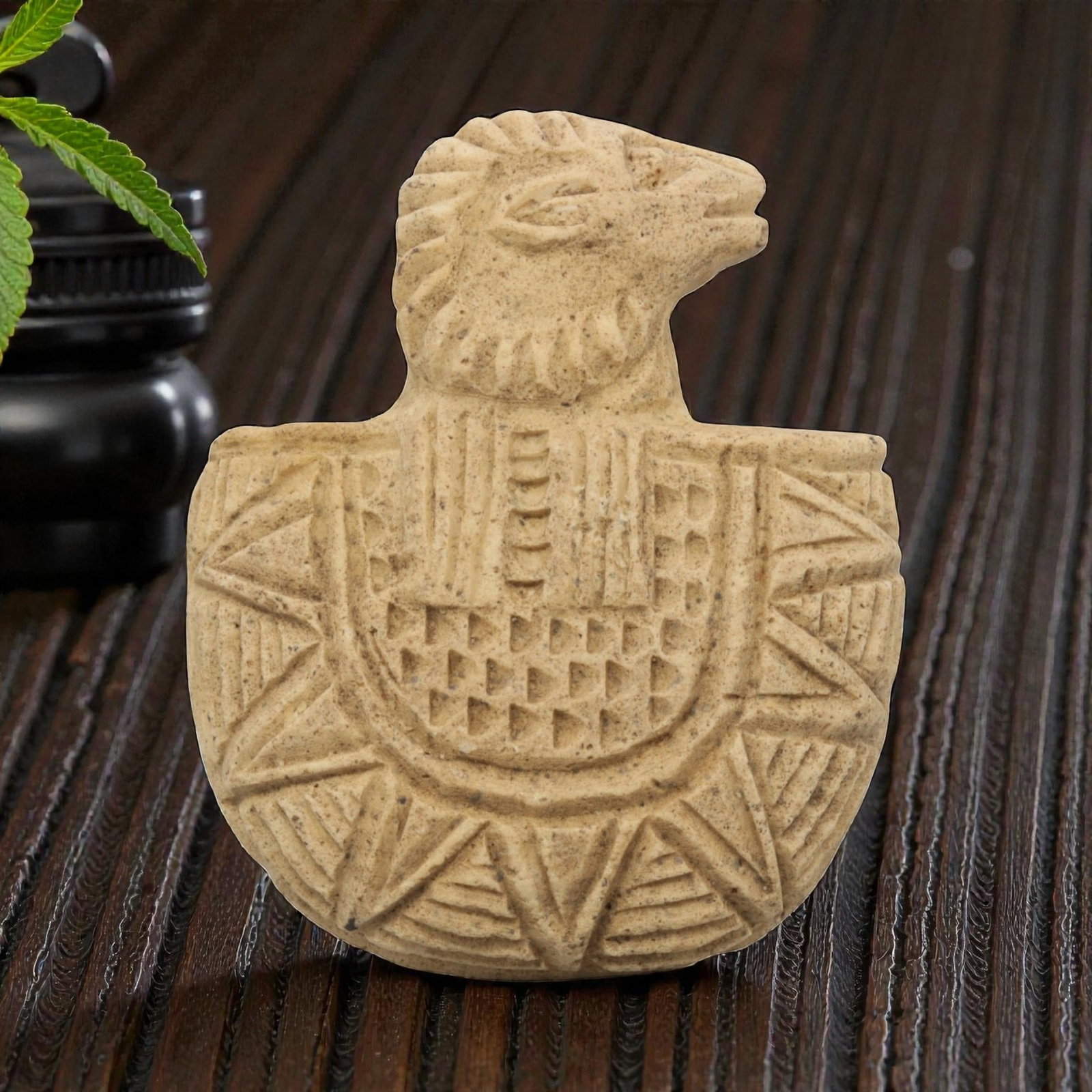 Ancient Stone Ram Amulet - Near Eastern Zoomorphic Figurine, 1ZY: Carved from a fine-grained, pale beige stone, this artifact takes the form of a zoomorphic amulet featuring a stylized ram's head surmounting a rounded, shield-shaped body. The ram's head is depicted 