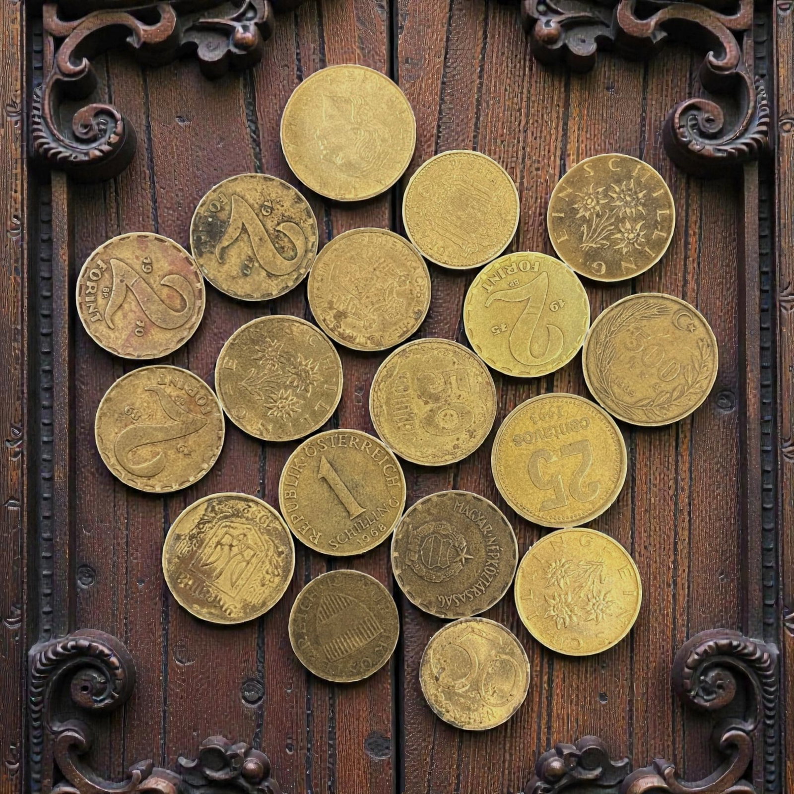 EUROPEAN CURRENCIES: Post-War Transition - Mixed Brass Coin Bulk Lot, 15V: This curated lot of European brass coins spans mid-20th century currencies, capturing the diverse monetary identities of Austria, Hungary, and beyond. The collection features Austrian Schillings adorn