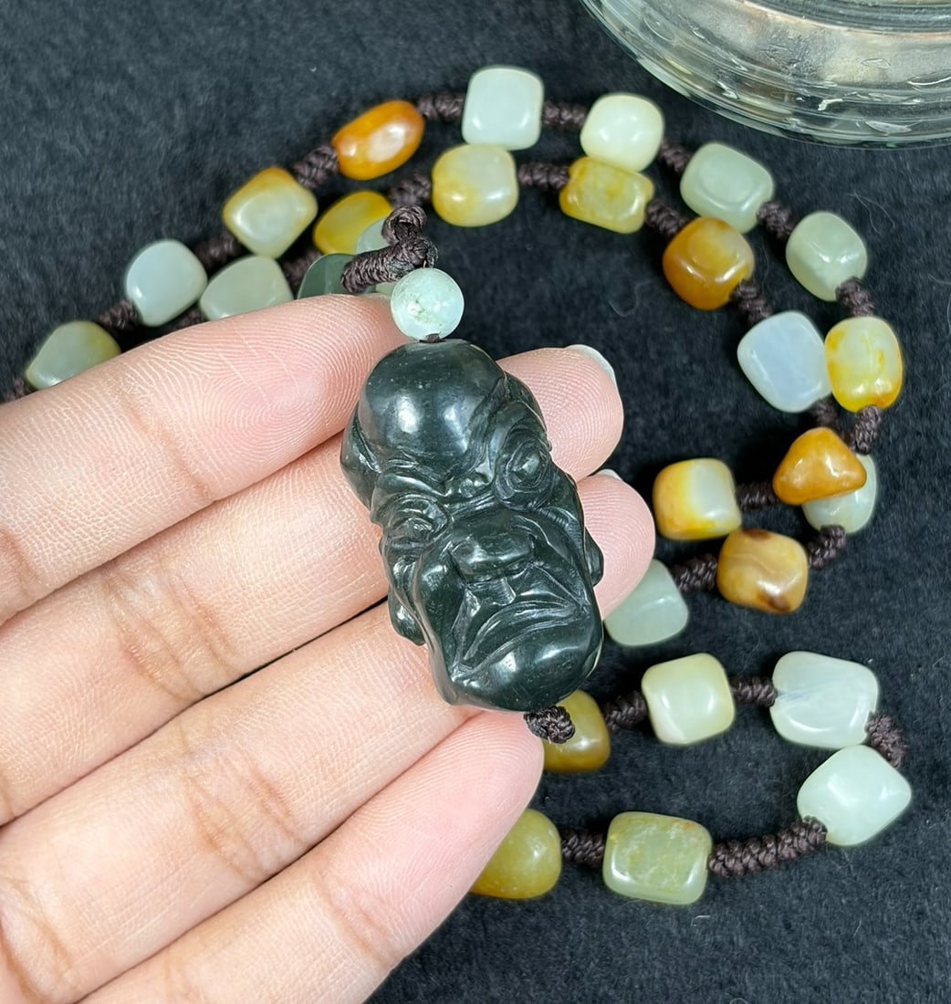 Natural Xinjiang Hetian Dark Green Luohan Head Russet Skin Seed Jade Necklace Pendant, 33AT: Measuring 62 cm in full wearable length, this necklace strand is constructed from genuine untreated Xinjiang Hetian nephrite river seed pebbles, each marked with natural warm amber and orange russet s