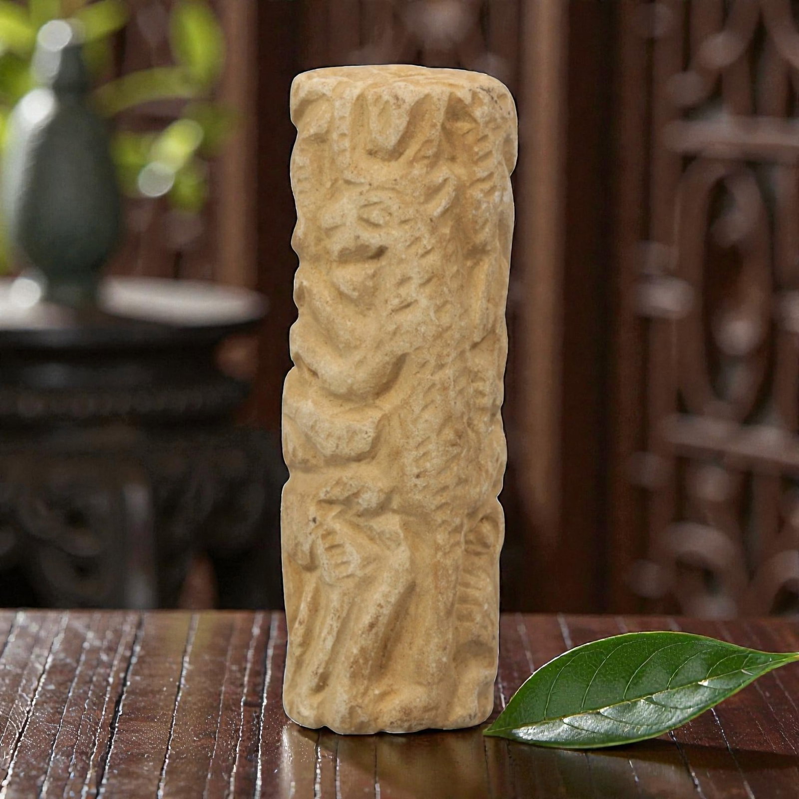 Ancient Limestone Anthropomorphic Bead - Near Eastern Carved Relief, 73ZQ: Carved from limestone, this ancient Near Eastern anthropomorphic bead features raised relief detailing along its cylindrical form, depicting stylized humanoid figures and geometric patterns typical of