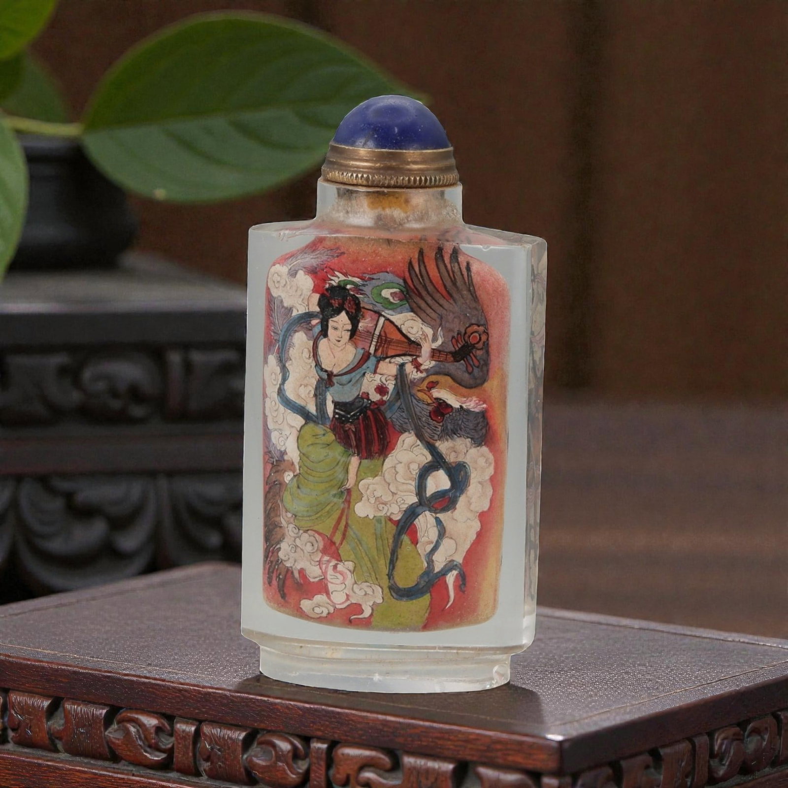 A Chinese Crystal Glass Inside-Painted Snuff Bottle, 20th Century, 59FG: The snuff bottle is formed from clear crystal glass and of flattened rectangular section, rising from a narrow recessed foot to a short cylindrical neck with a flat rim. The interior is finely painted