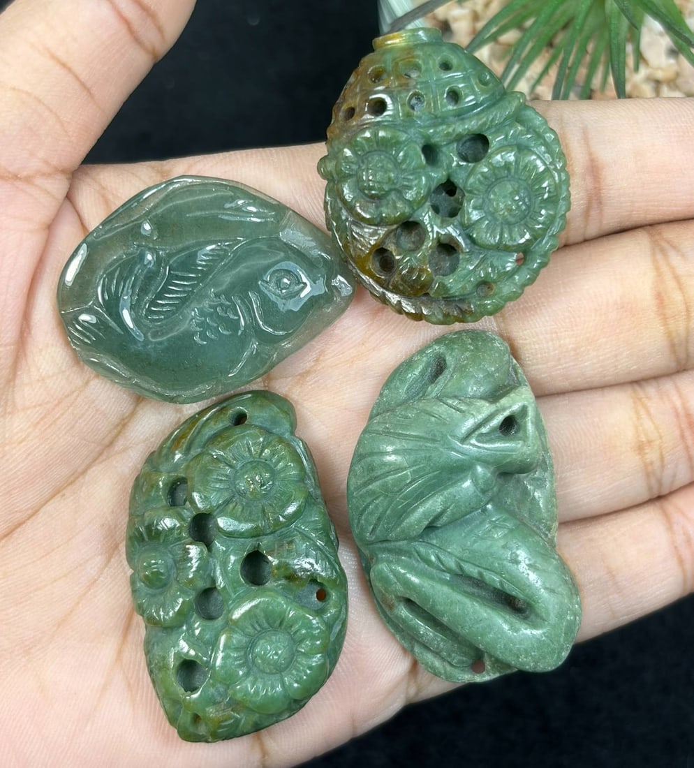Lot Of 4 Natural Burmese Type A Jadeite Jade Carved Pendants, 26AS: This four-piece assortment consists of hand-carved pendants crafted from untreated natural Type A Burmese jadeite jade, showcasing traditional auspicious Chinese designs including a relief fish motif 