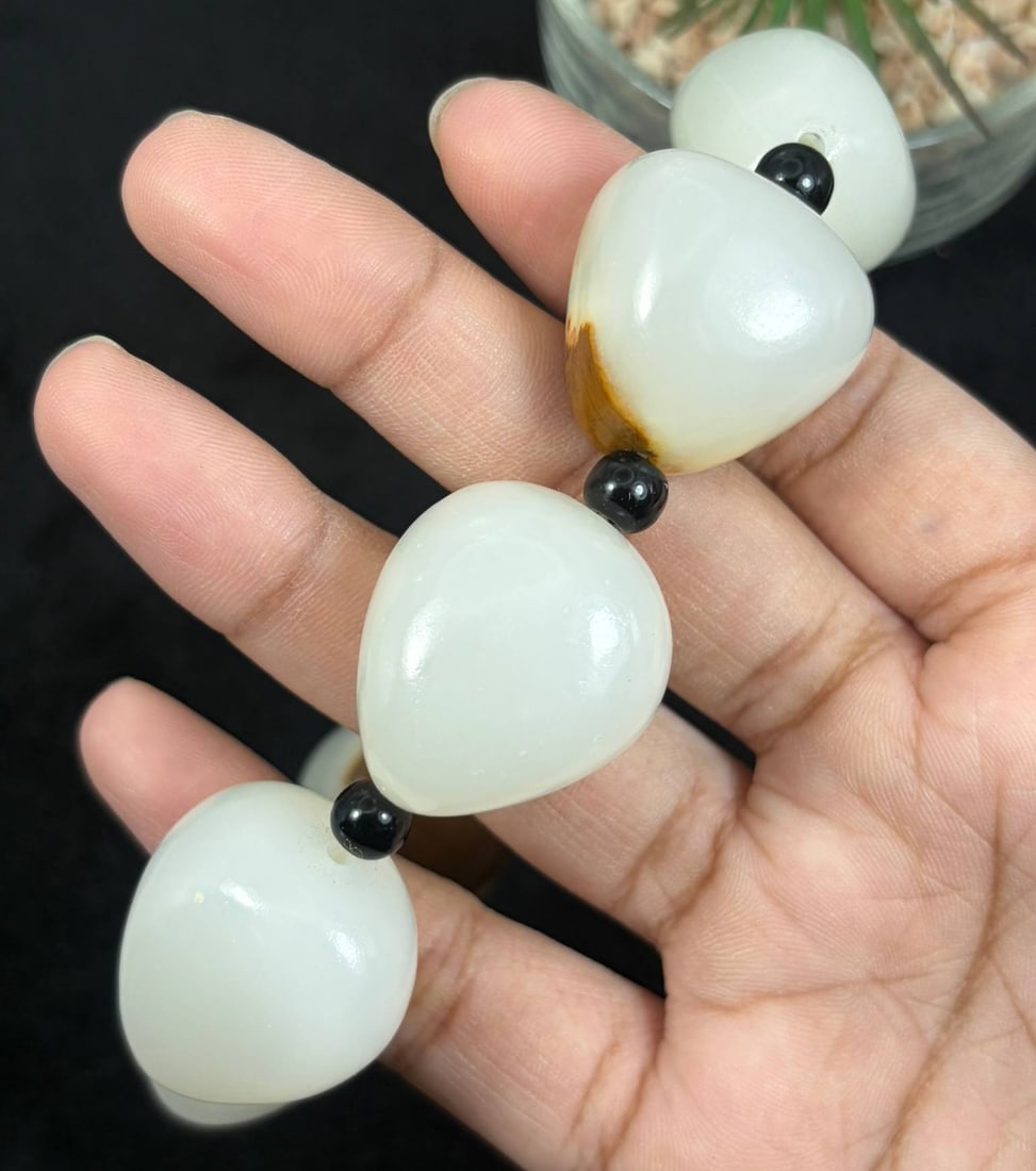 Chinese Natural White Nephrite Jade Bracelet with Raw Brown Skin Beads, Pebble Jade Beads, 14AS: Hand-strung single strand bracelet crafted from natural white nephrite jade pebble beads, each measuring 2.5cm in irregular teardrop shape. Most beads feature smooth milky white polished jade surfaces