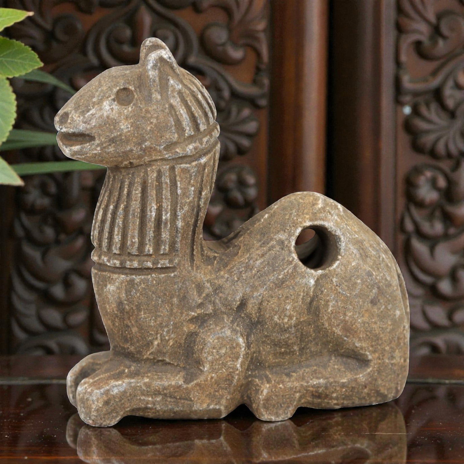Ancient Stone Camel Amulet - Near Eastern Desert Talisman, 26AM: This amulet is carved from warm beige stone with natural speckling and a weathered patina, depicting a stylized camel in a recumbent, crouched posture. The piece features incised linear detailing defi