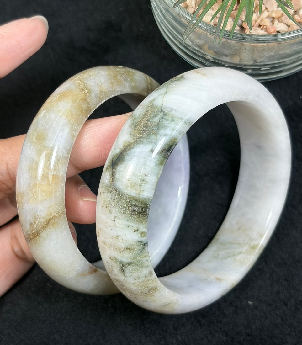 Lot of 2 Natural Burmese Type A Landscape Jadeite Bangles, 53mm & 58.2mm Inner Diameter, 32AV: Two untreated authentic Type A jadeite bangles with inner diameters 53mm and 58.2mm, creamy white base naturally marked with earthy golden russet and dark moss green mineral veining forming unique nat