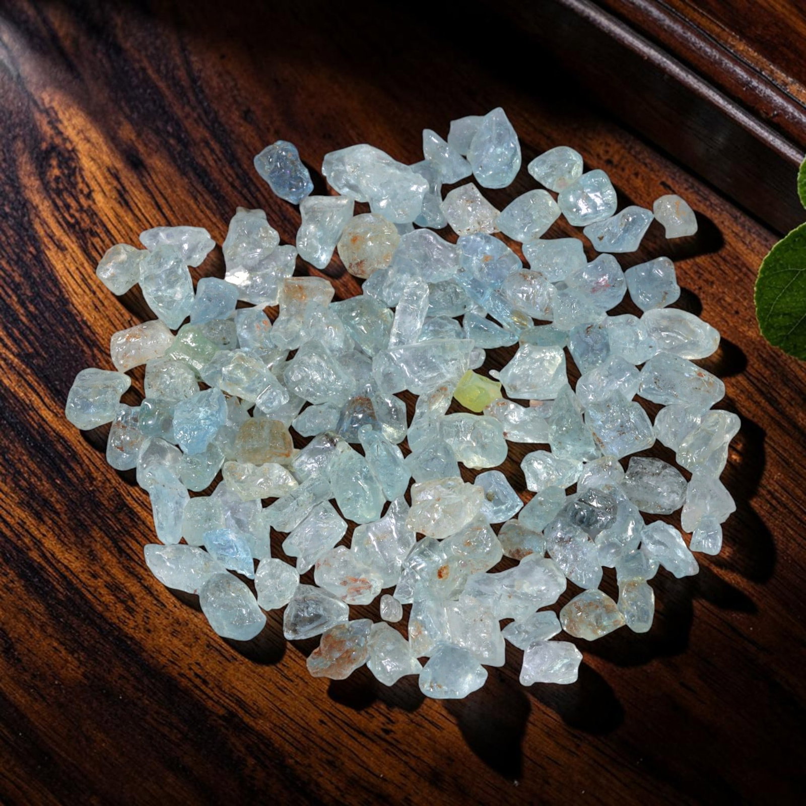 123.37 Carats Natural Aquamarine Rough Parcel, 93YH: This luminous parcel of natural aquamarine rough showcases the classic soft sky-blue hue the gem is known for, ranging from pale, translucent tones to deeper, more saturated blues. The stones are in t