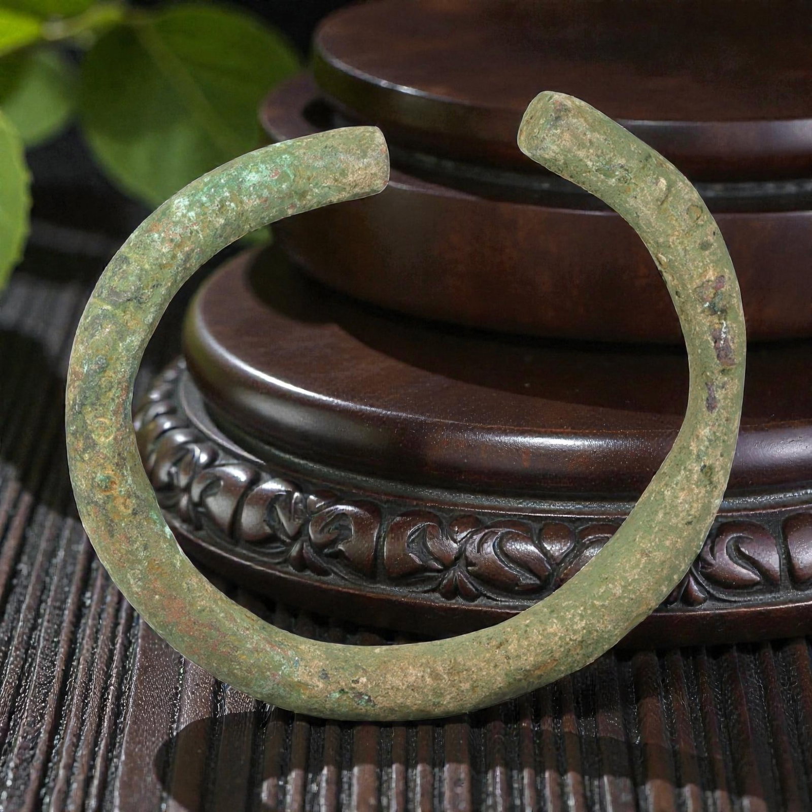Ancient Bronze Bracelet - Roman Open Cuff Bangle, 38BN: An open-form bracelet crafted from thick cast bronze, with a robust rounded cross-section and squared terminals. The utilitarian form is characteristic of Roman provincial jewelry, designed for durabi