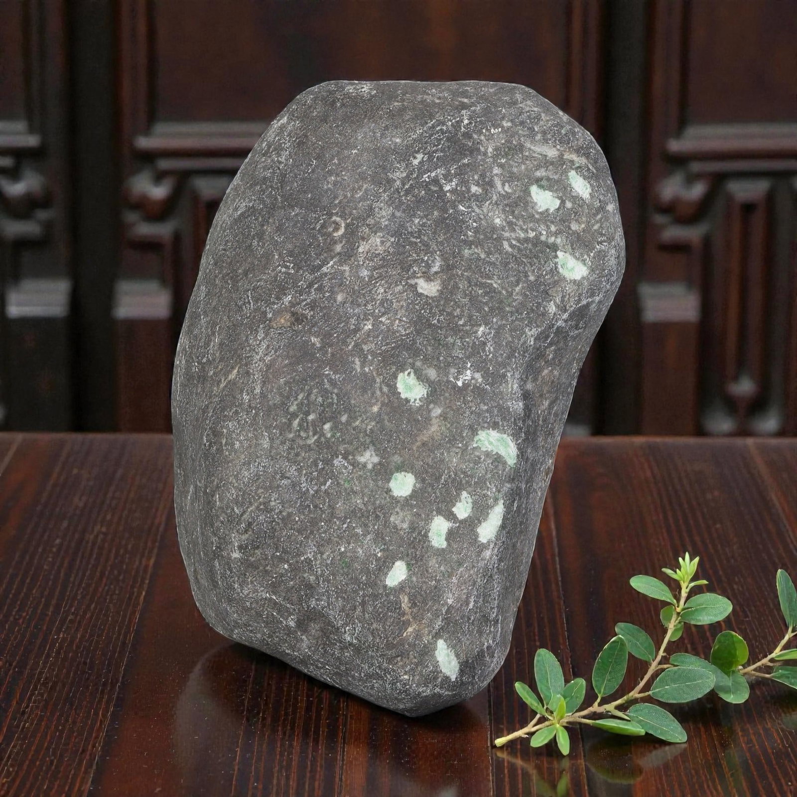 2870ct Natural Burmese Dark Skin Green Spotted Jadeite Jade Rough Stone, 88EA: This is a natural Type A Burmese jadeite jade rough stone, measuring 10x6.2cm and weighing 574g (2870ct). It features a rugged dark grey mine skin with scattered light green jadeite spots naturally vi