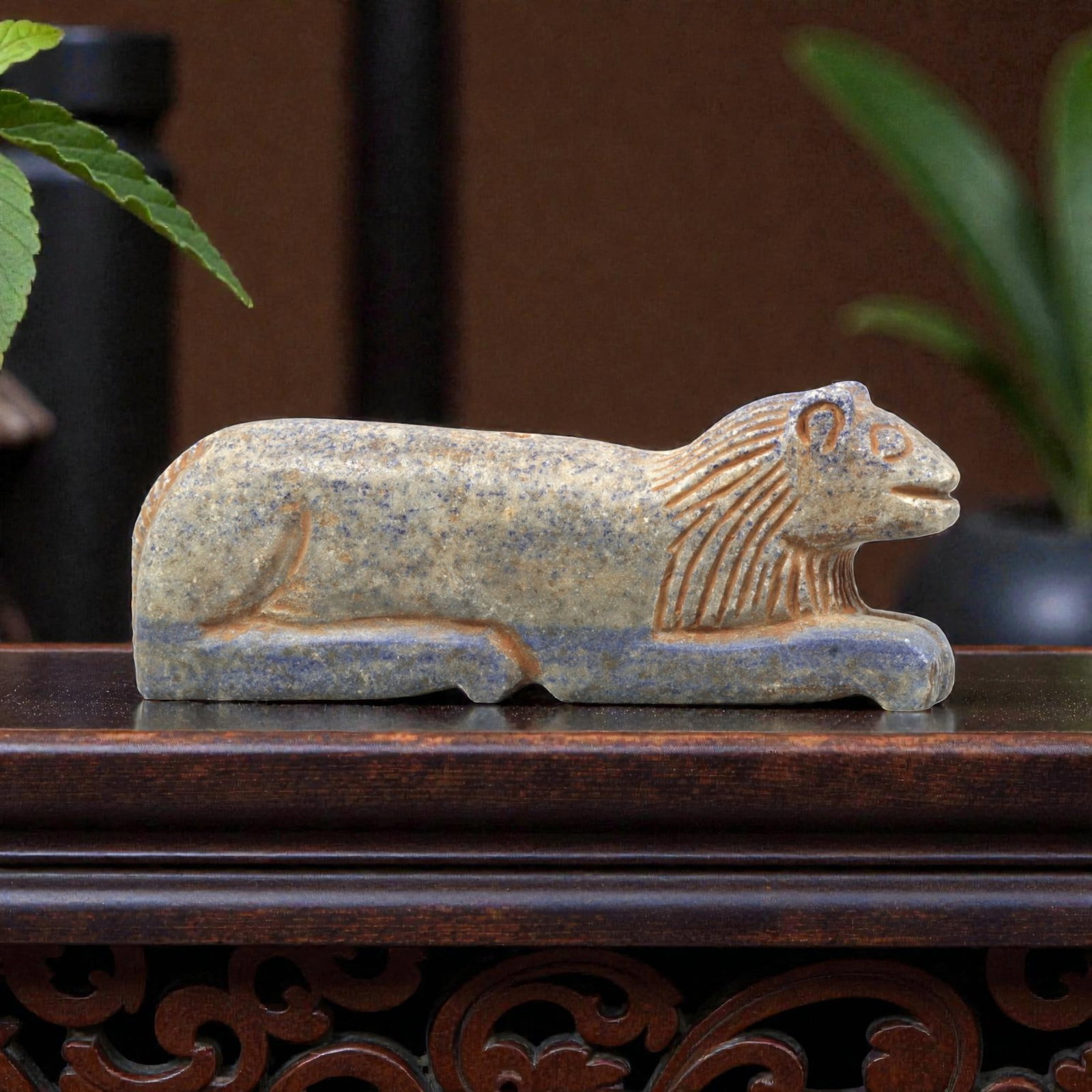 Near Eastern Lapis Lazuli Plaque - Tribal Art Lion Figurine Relief, 26ZA: Carved from solid lapis lazuli, this Near Eastern tribal art piece is shaped as a stylized recumbent lion figurine, executed with detailed tribal craftsmanship. The lion is rendered in a stretched, pr