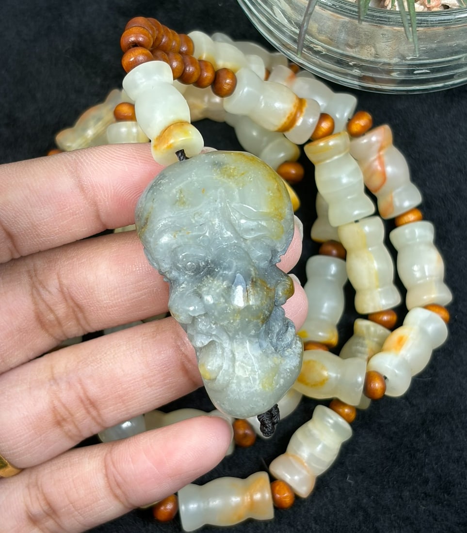 Natural Xinjiang Hetian Jade Luohan Head Pendant Necklace - Chinese Carved Amulet, 80YJ: This necklace features a natural Xinjiang Hetian jade luohan head pendant paired with matching Hetian jade beads, accented with small wooden spacers. The pendant is carved from greyish Hetian jade wit