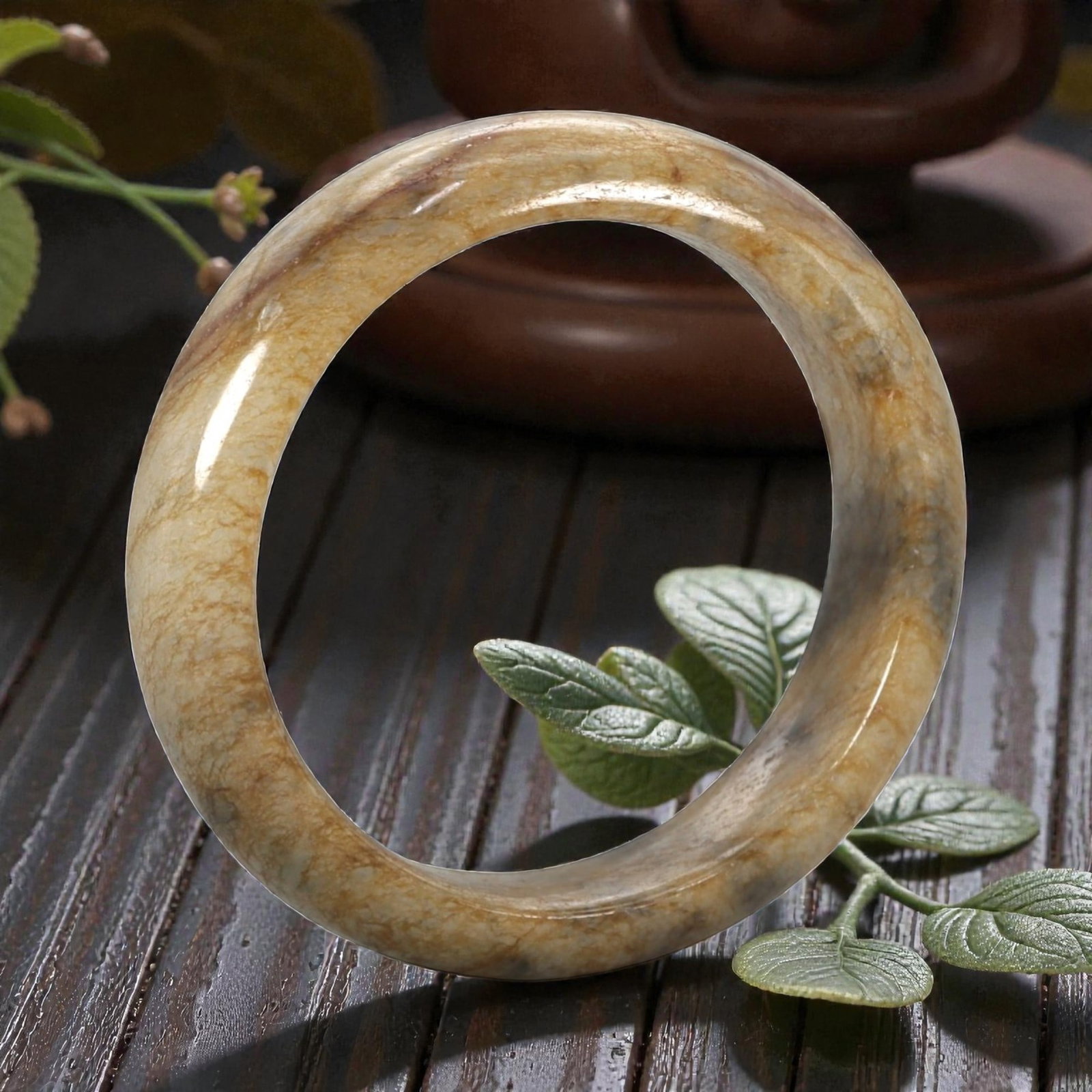 Natural Burmese Type A Jadeite Jade Bangle Bracelet, 20th Century, 91ZK: Carved from jadeite jade with a pale creamy-tan base and fine, irregular brownish veining throughout, the bangle is formed as a continuous circular band with a rounded cross-section. The surface is sm